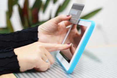 Woman holding tablet pc and credit card , Internet Shopping Concept